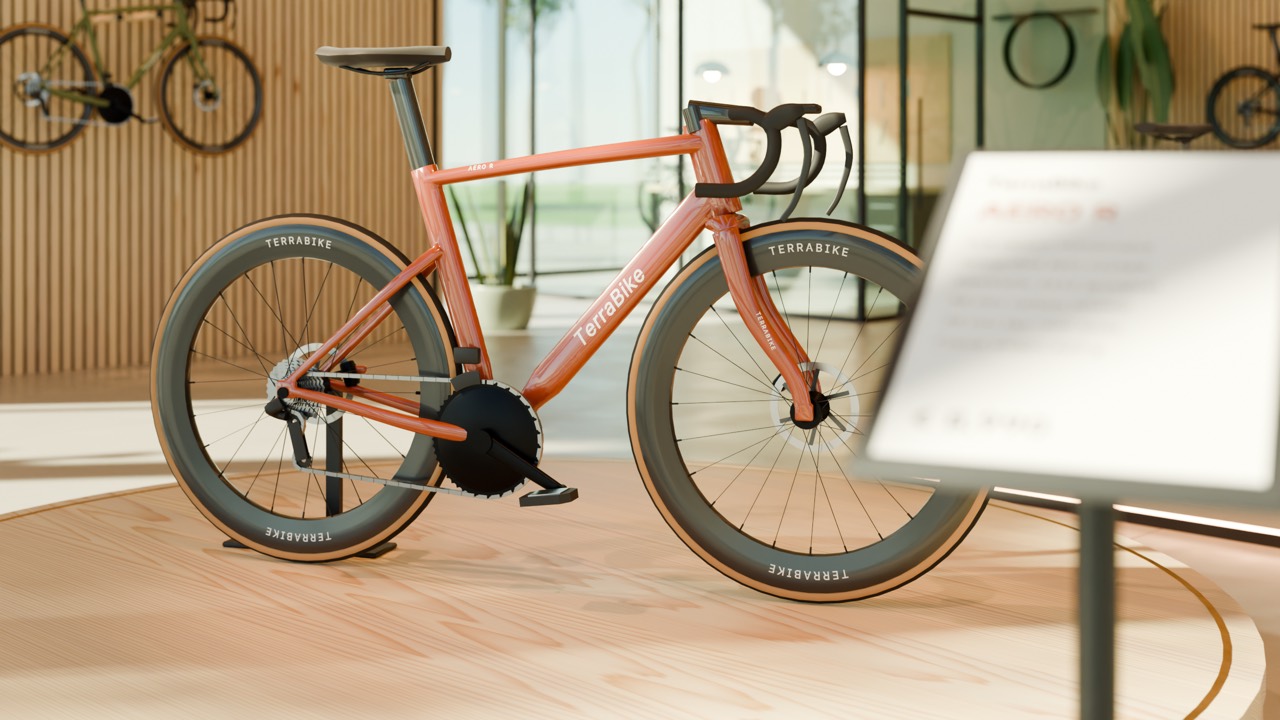 Close-up of an orange road bike on a circular timber display plinth.